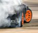 Race drift car burning tires on speed track